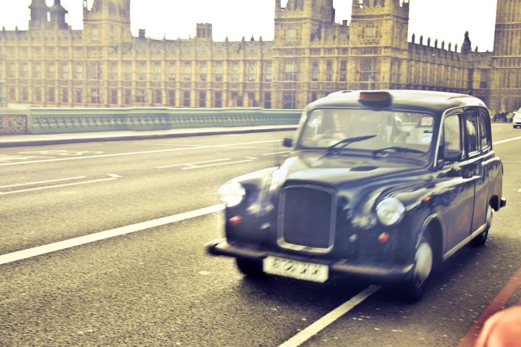 Black cab by the houses of parliament
