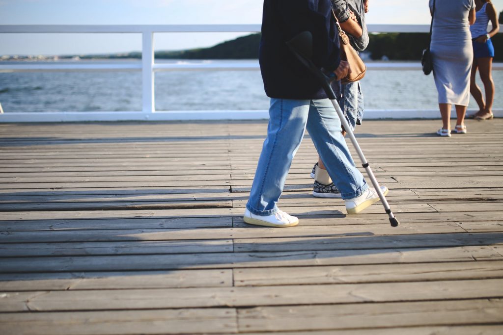Injured woman walking on a pier